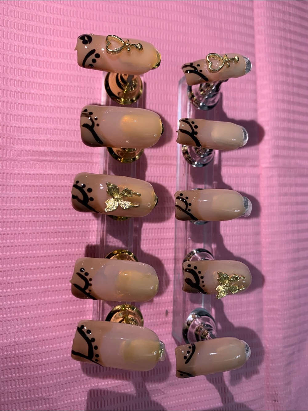 Nude Press-On Nails with Black Accents & Gold Charm